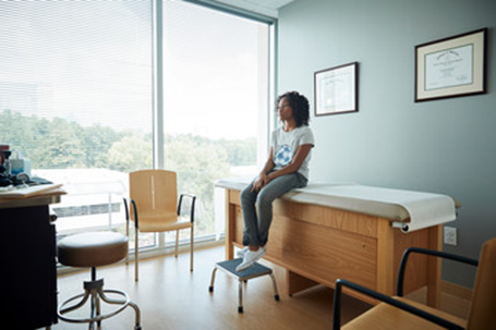 Woman at AFC Urgent Care Saugus waiting to be tested for thyroid disease