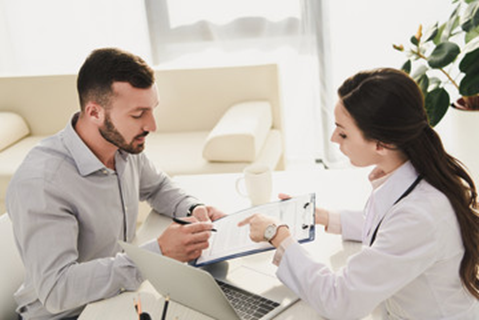 Male patient getting screened for a thyroid disorder at AFC Urgent Care West Springfield