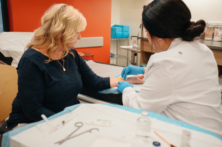 Female Patient Receiving Stitches at AFC Cedar Hills