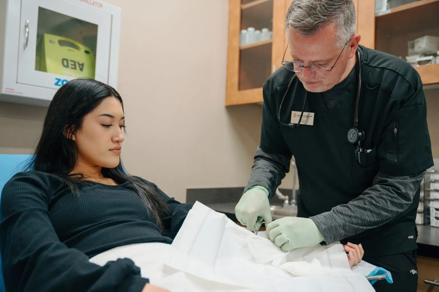 Patient getting sutures at AFC Urgent Care Fort Collins