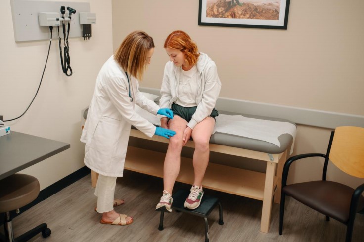 Female patient getting checked for ringworm on leg