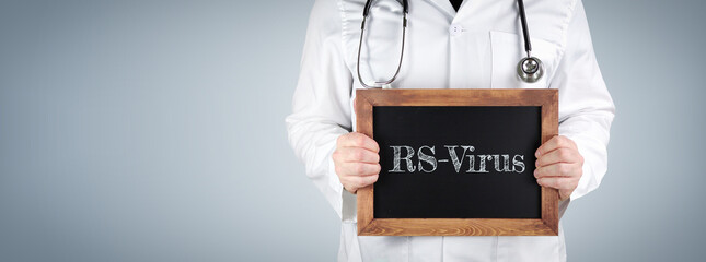 A doctor holding up a sign about RSV suggesting that you should come to AFC Urgent Care Rocky Hill for treatment.